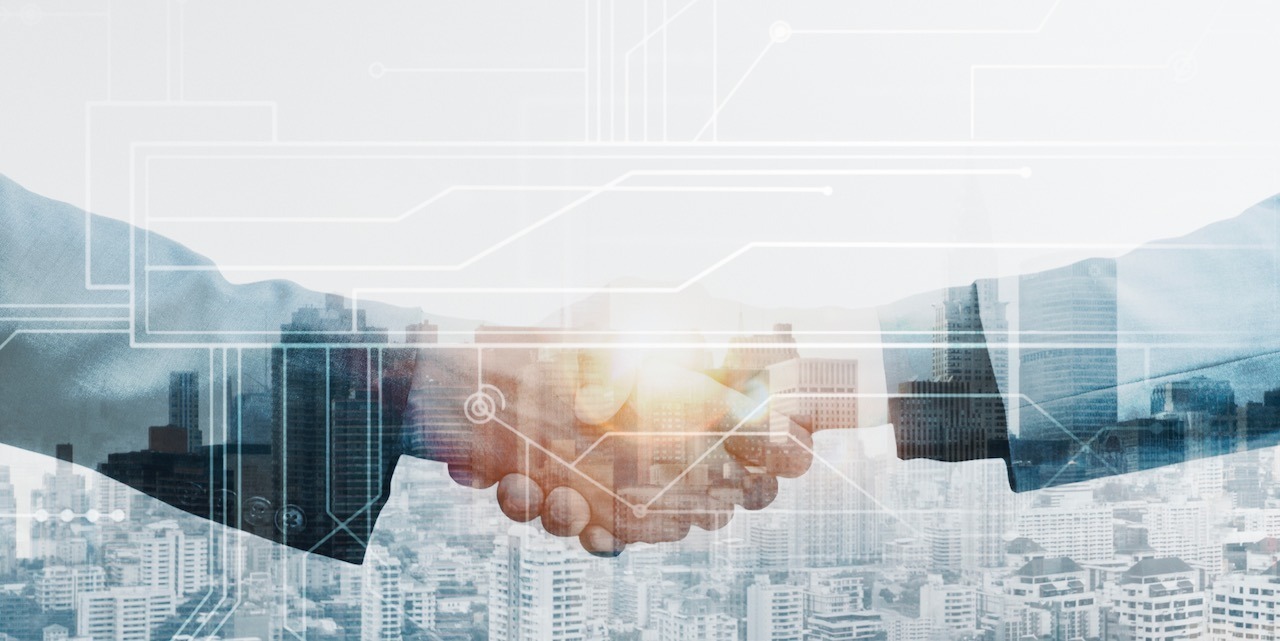 Business partners handshake global corporate with technology concept
