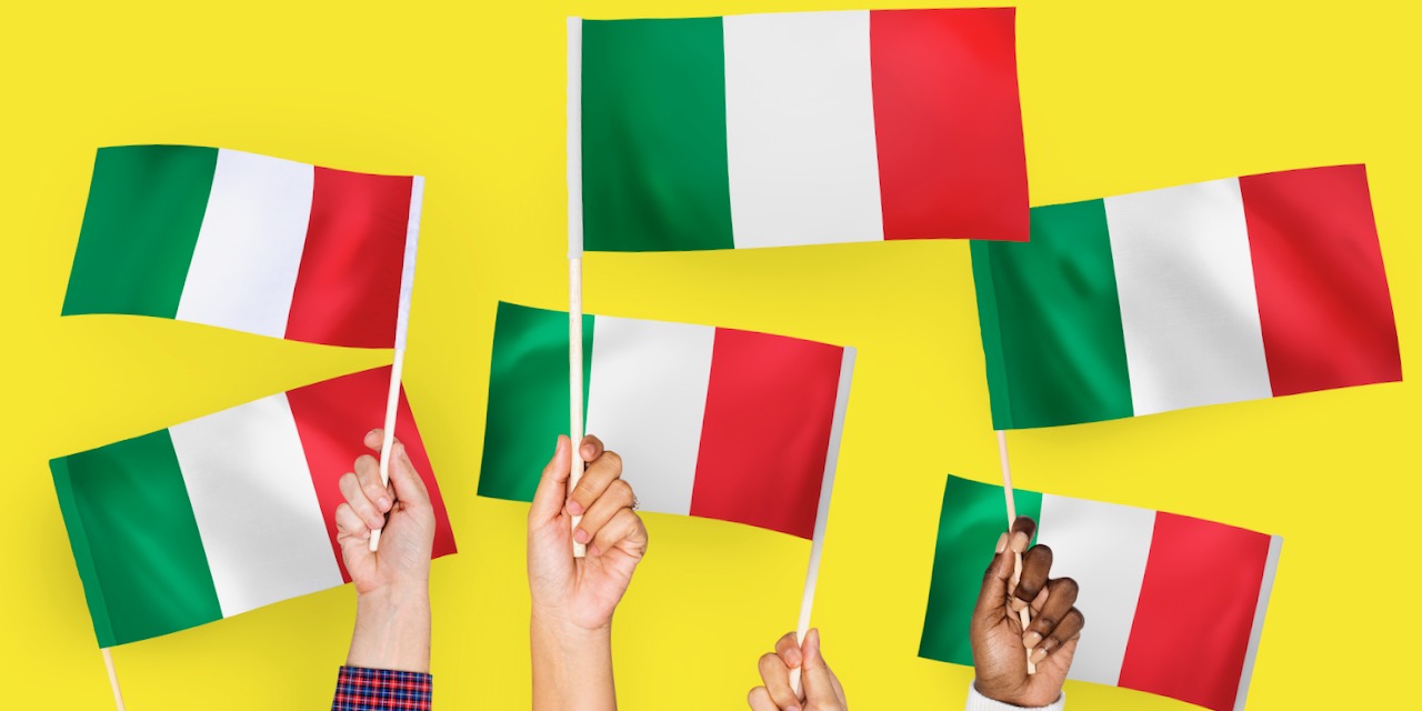 Hands waving flags of Italy