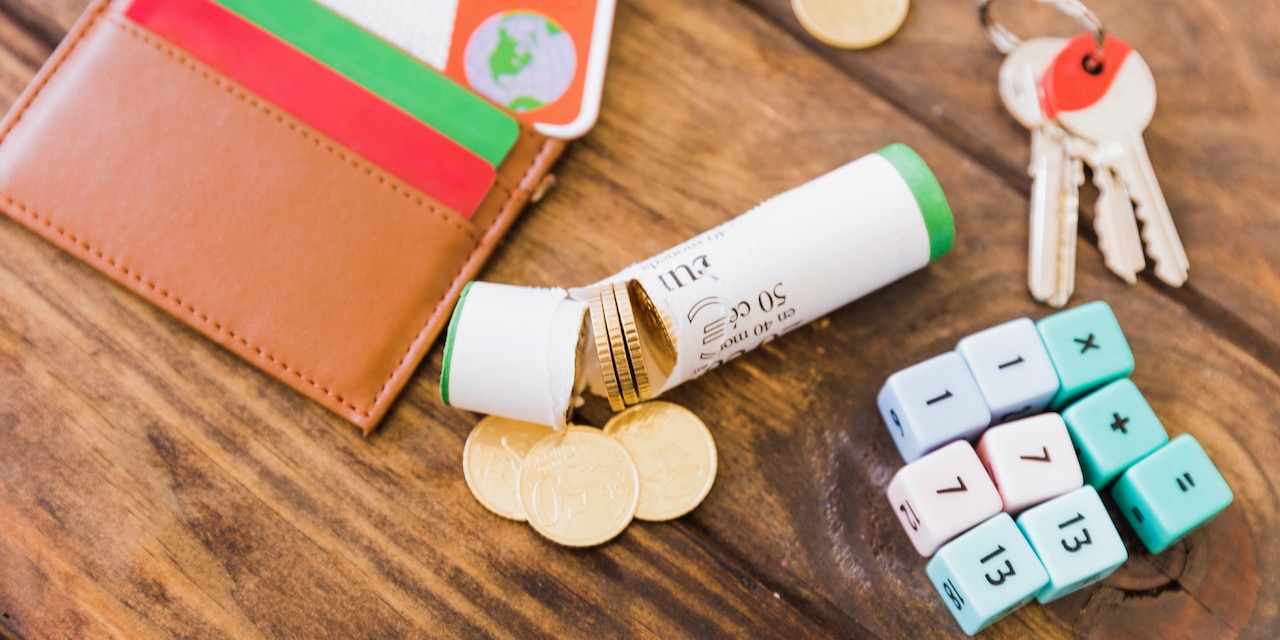 broken-wrapper-with-euro-coins-near-math-blocks-key