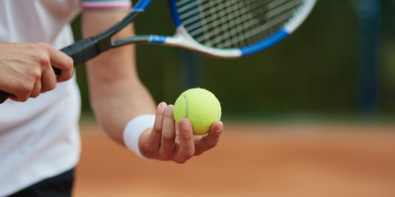 Tennis player is trying to hit the score