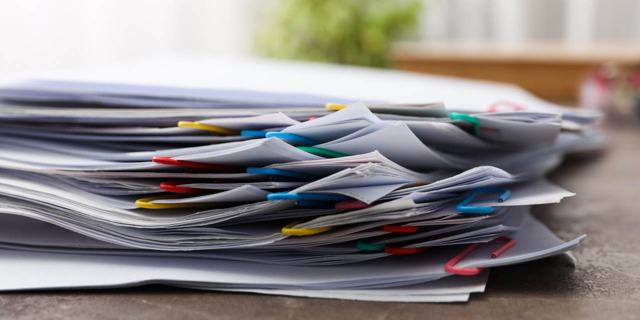 Concept of different office accessories – paper with clip