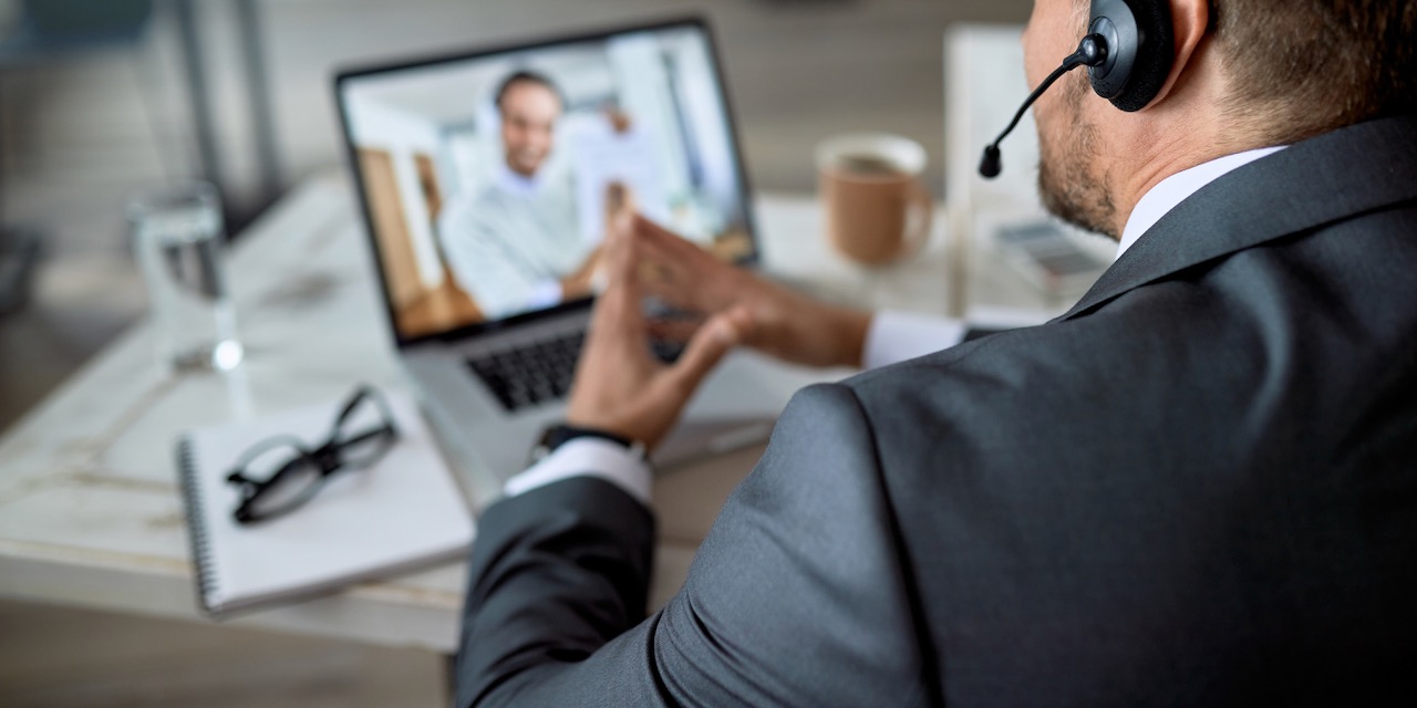 Close-up of a businessman making video call from his office.